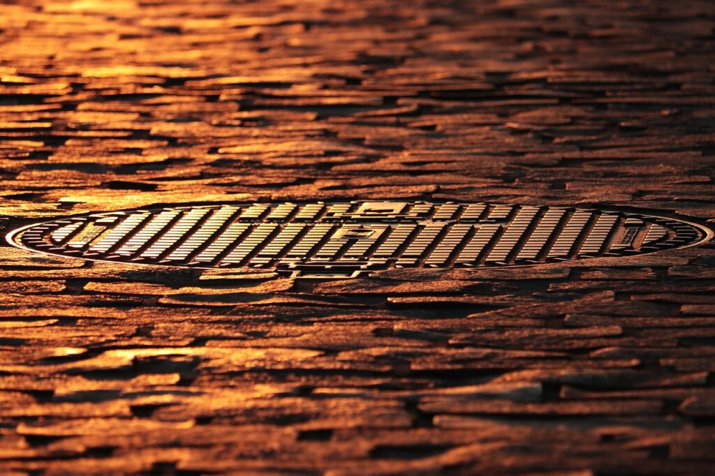 how much does a manhole cover weigh